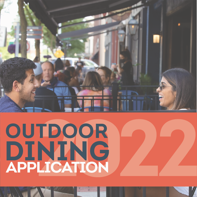 Couple enjoys an outdoor dining area with text Outdoor Dining Application